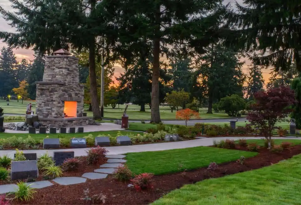 Beautiful garden with stone fireplace and walking paths at Mountain View Memorial Park.