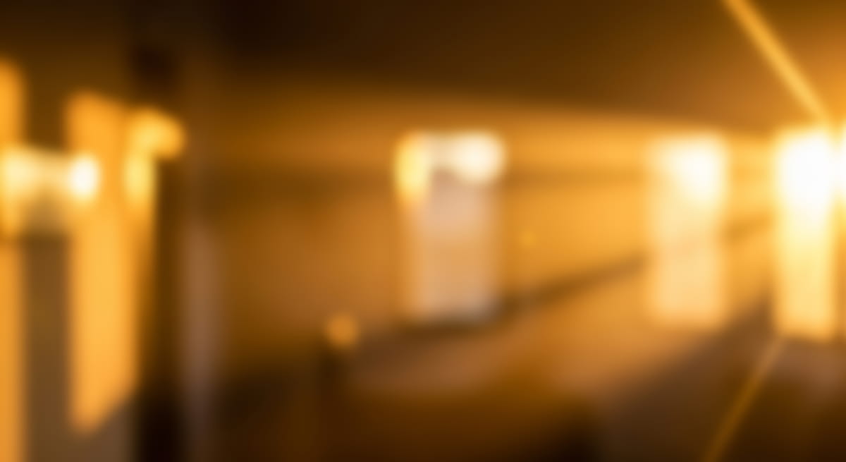Blurred view of memorial park with warm sunset lighting.